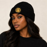 Ananci Signature Beanie in black with gold embroidered spider patch