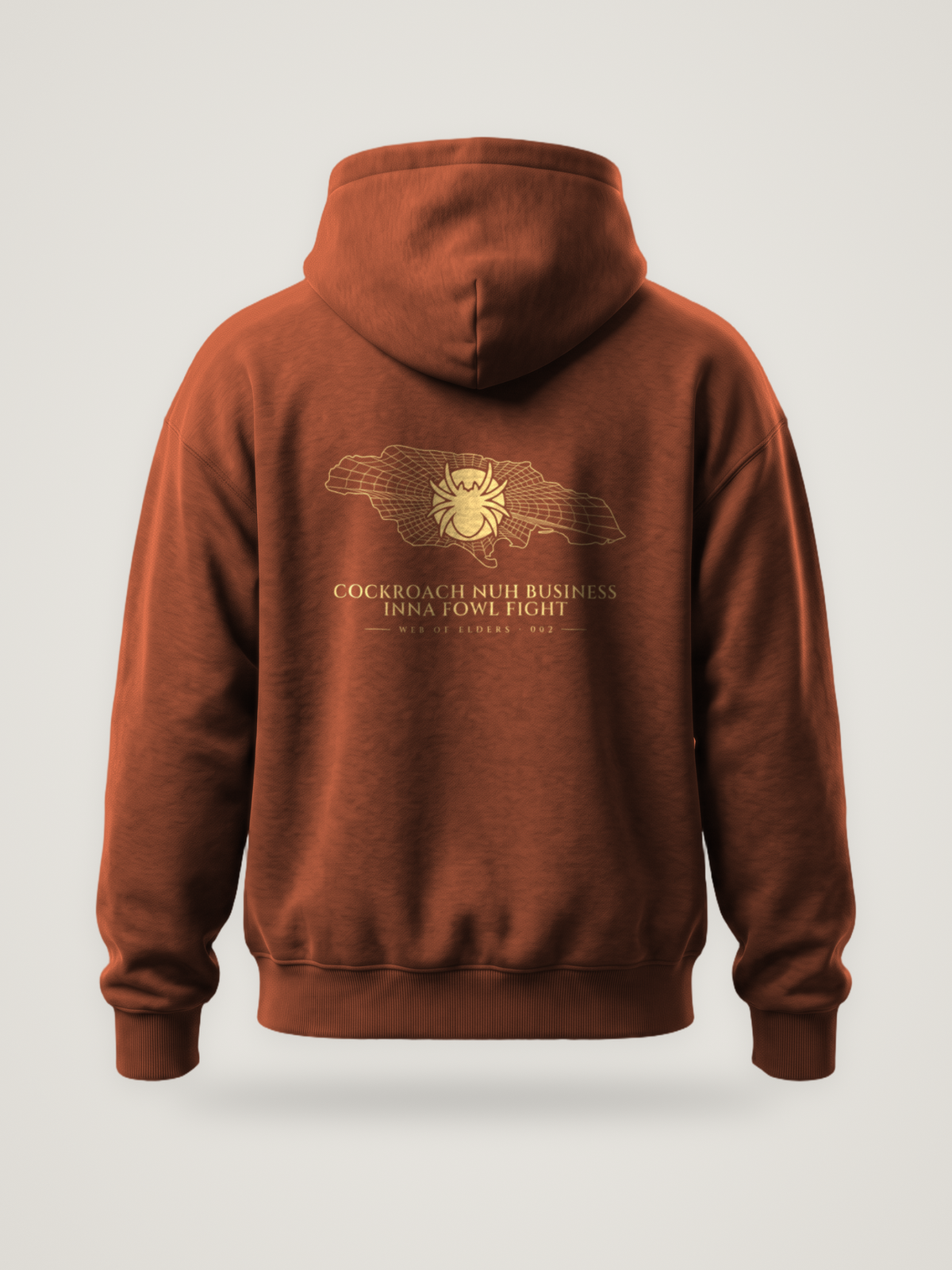 Back of the clay ANANCI Web of Elders 002 hoodie with “Cockroach Nuh Business Inna Fowl Fight” in light gold under a spider on a web-lined map of Jamaica