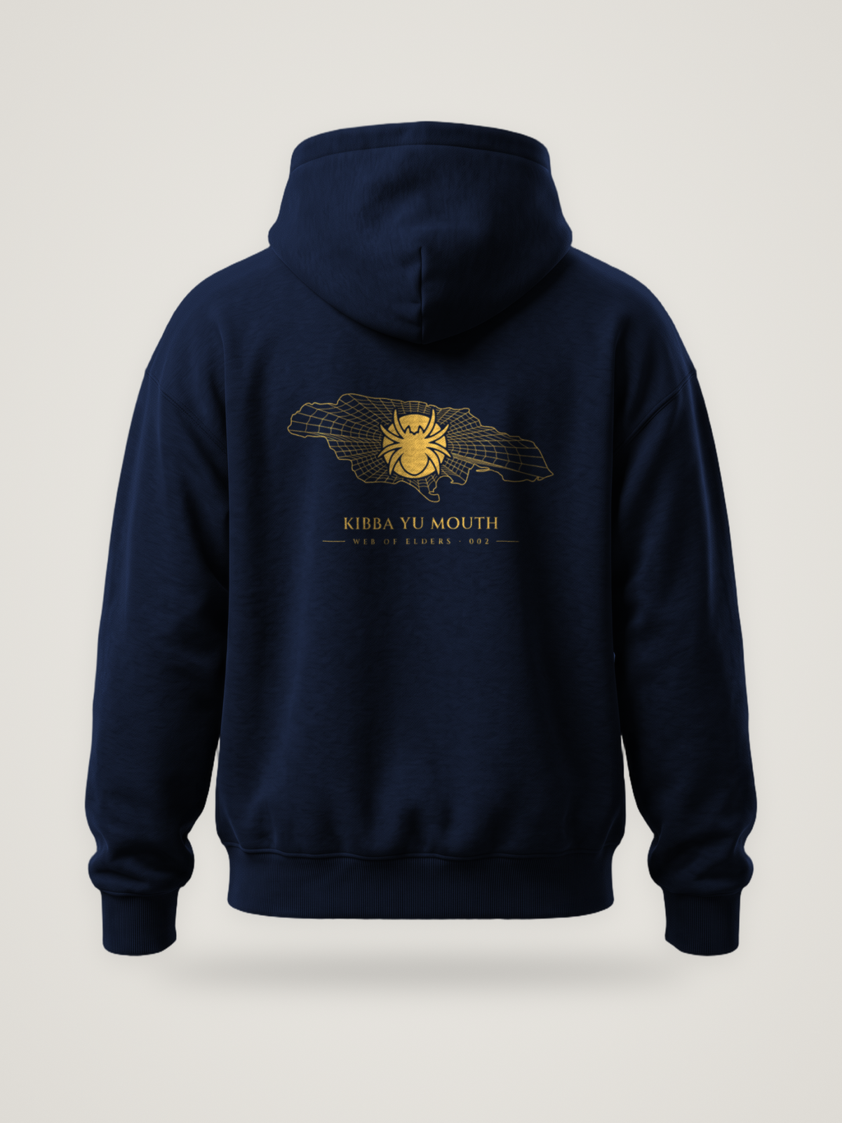Back of the midnight ANANCI Web of Elders 002 hoodie with “Kibba Yu Mouth” in gold under a spider on a web-lined map of Jamaica