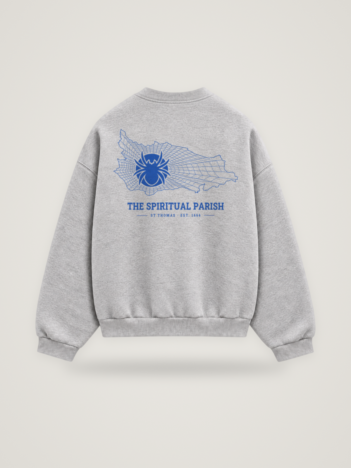 Back of the heather grey ANANCI Where Yuh From? St Thomas crewneck with the St Thomas map, web and spider in cobalt ink, “THE SPIRITUAL PARISH” and ST THOMAS · EST. 1664