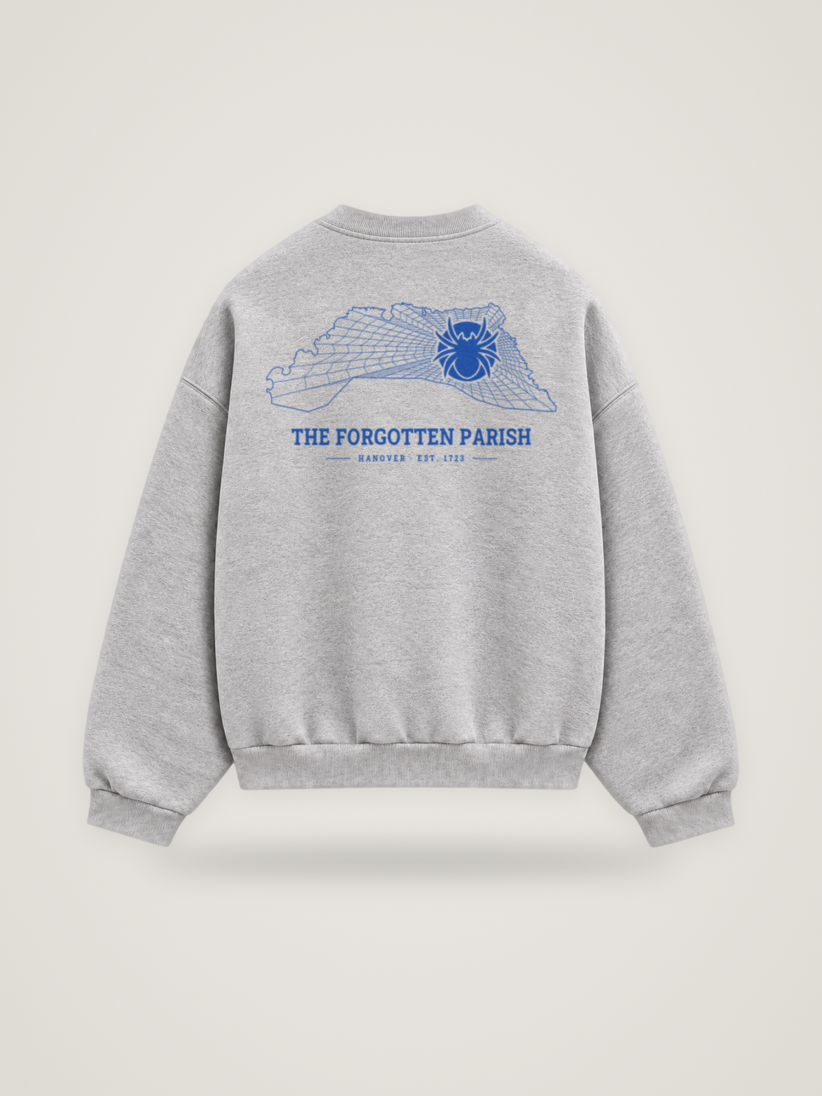 Back of the heather grey ANANCI Where Yuh From? Hanover crewneck with the Hanover map, web and spider in cobalt ink, “THE FORGOTTEN PARISH” and HANOVER · EST. 1723