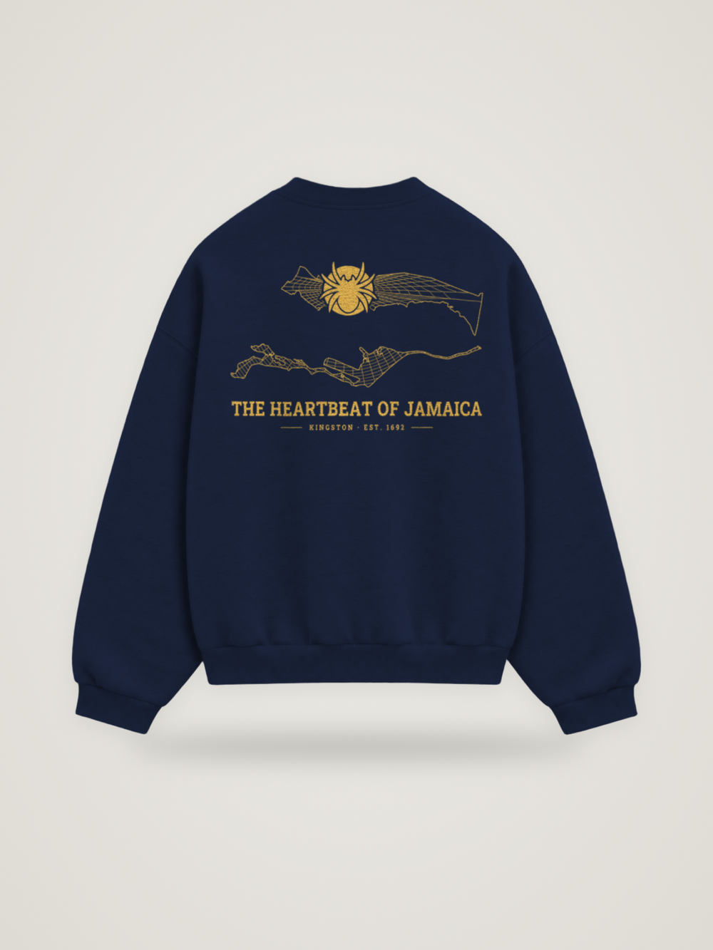 Back of the midnight ANANCI Where Yuh From? Kingston crewneck with the Kingston map, web and spider in gold ink, “THE HEARTBEAT OF JAMAICA” and KINGSTON · EST. 1692
