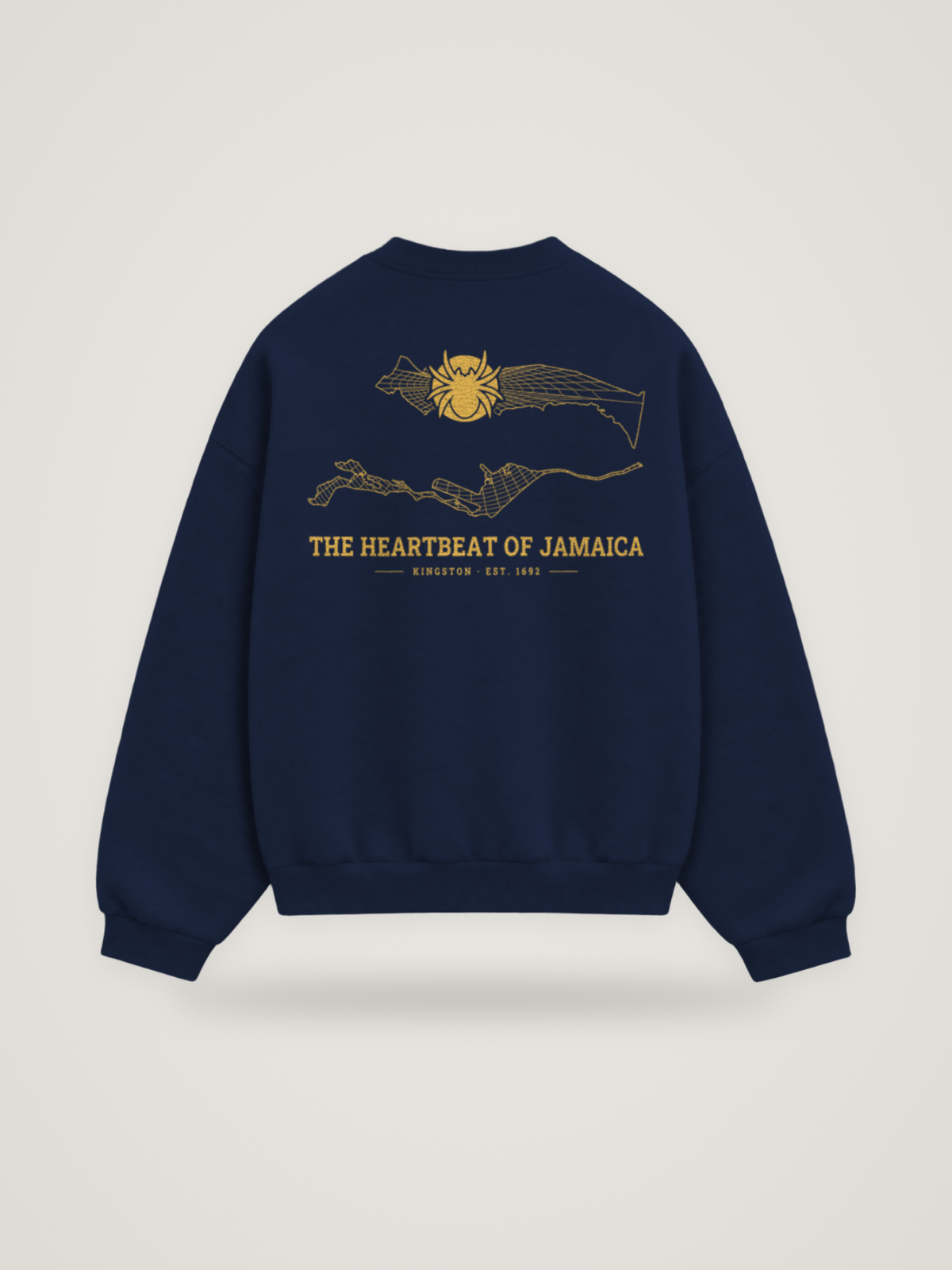 Back of the midnight ANANCI Where Yuh From? Kingston crewneck with the Kingston map, web and spider in gold ink, “THE HEARTBEAT OF JAMAICA” and KINGSTON · EST. 1692