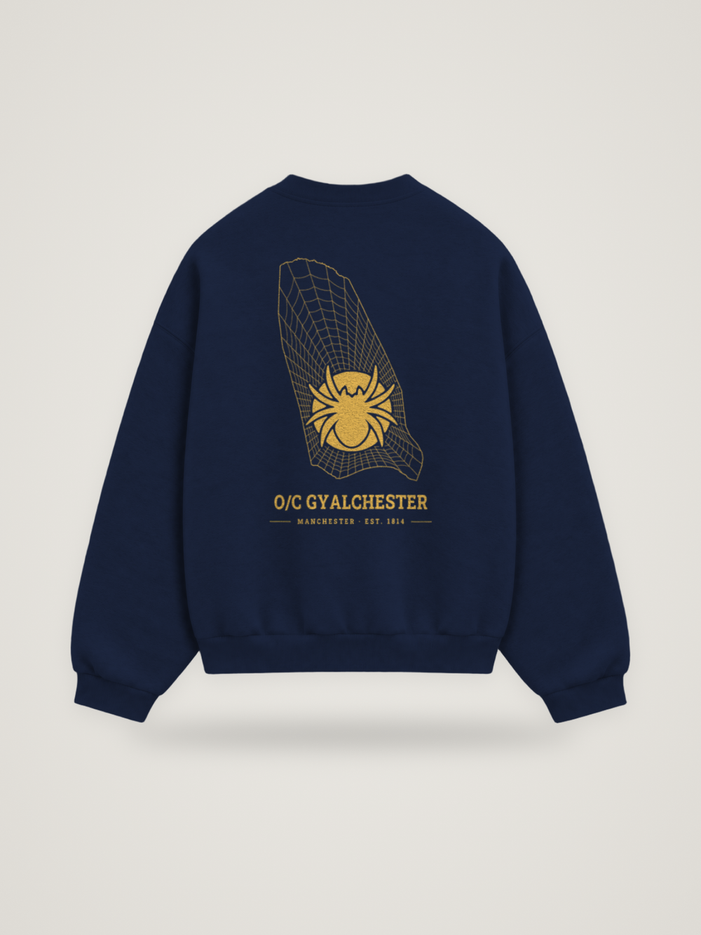 Back of the midnight ANANCI Where Yuh From? Manchester crewneck with the Manchester map, web and spider in gold ink, “O/C GYALCHESTER” and MANCHESTER · EST. 1814