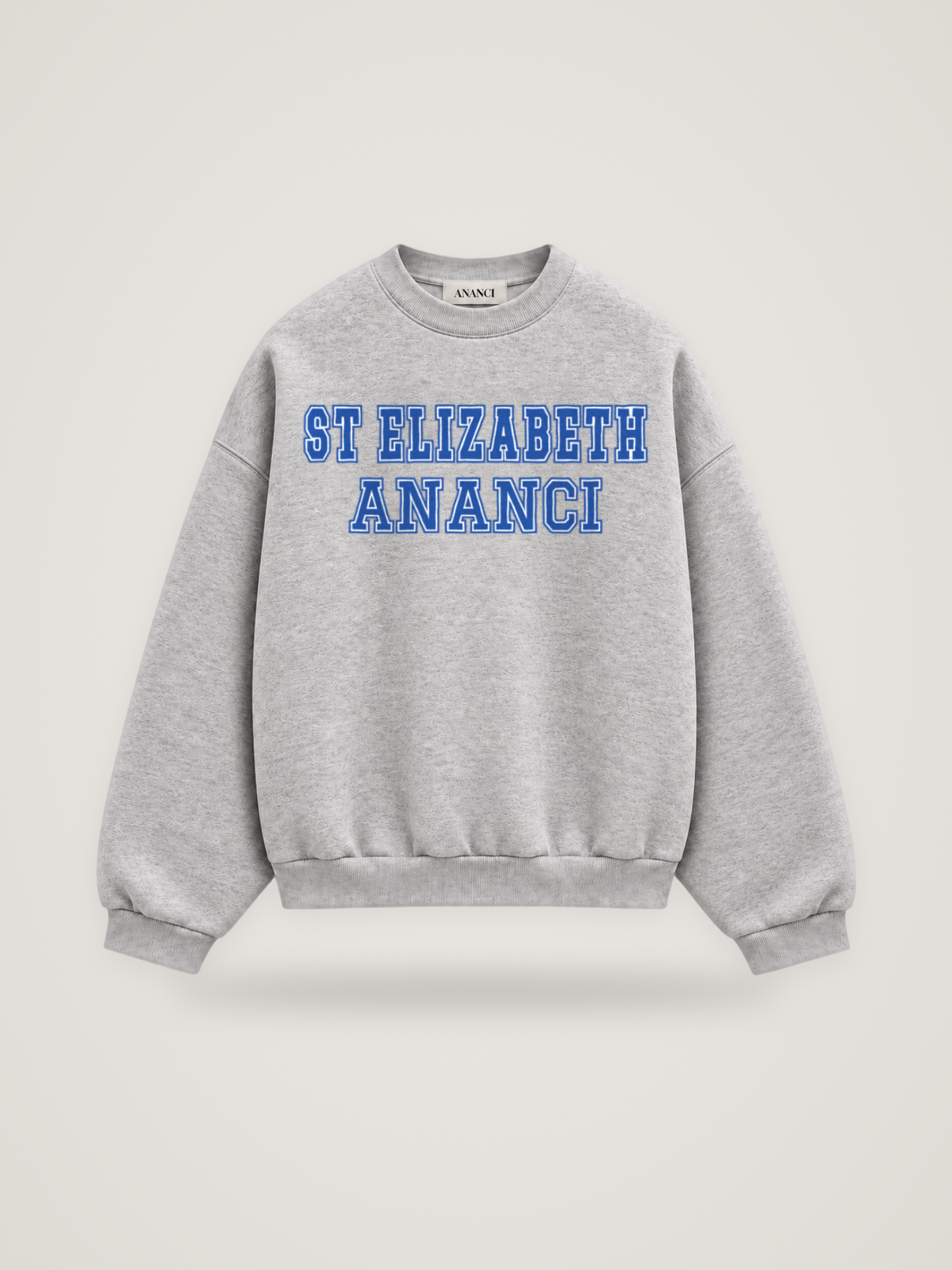 Front of the heather grey ANANCI Where Yuh From? St Elizabeth crewneck with straight two-tone varsity lettering, cobalt with a white inline, reading ST ELIZABETH over ANANCI
