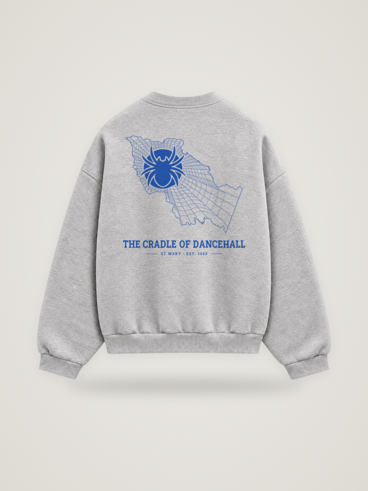 Back of the heather grey ANANCI Where Yuh From? St Mary crewneck with the St Mary map, web and spider in cobalt ink, “THE CRADLE OF DANCEHALL” and ST MARY · EST. 1665