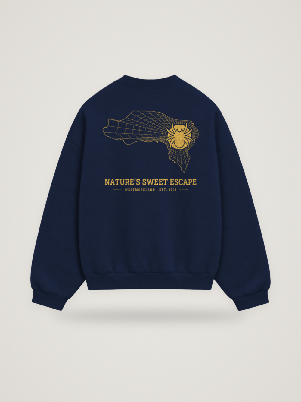 Back of the midnight ANANCI Where Yuh From? Westmoreland crewneck with the Westmoreland map, web and spider in gold ink, “NATURE’S SWEET ESCAPE” and WESTMORELAND · EST. 1703