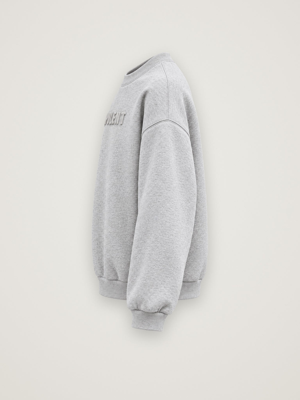 Side profile of the heather grey ANANCI Opulent crewneck showing the drop shoulder and ribbed cuff